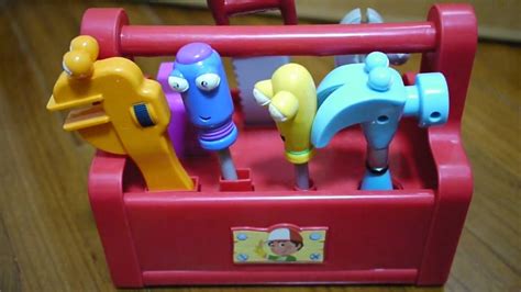 Handy manny tool box - Some wear, scratches/scuffs on the tool box, paint flaws here and there on tools, scuff marks and chips on the screwdriver, some chipped spots and marks on the saw’s eyes (see photos). This is the non singing version of this toolbox. Toolbox is 9.5x6x4 inches